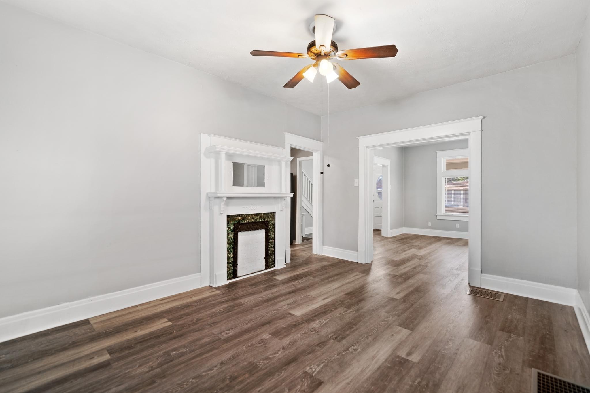 Living room after renovation with neutral walls and new flooring