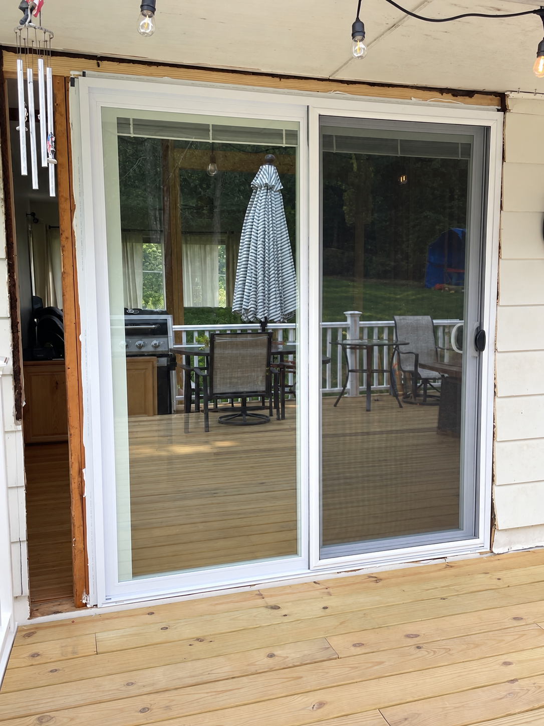 New sliding glass doors installed in place of the former window
